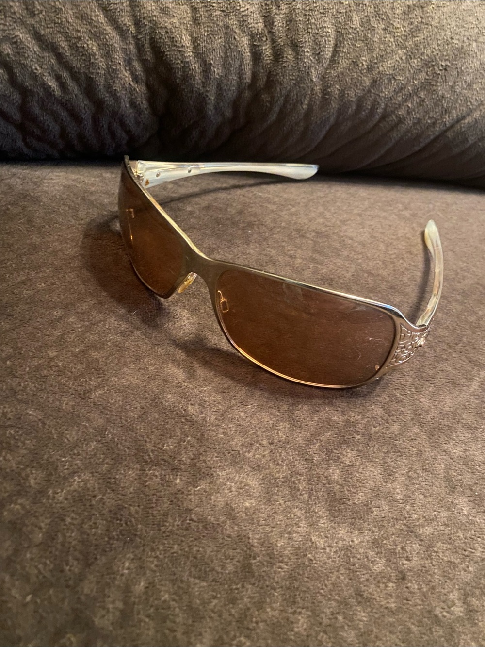 Oakley Silver Frame Sunglasses with Brown Lenses